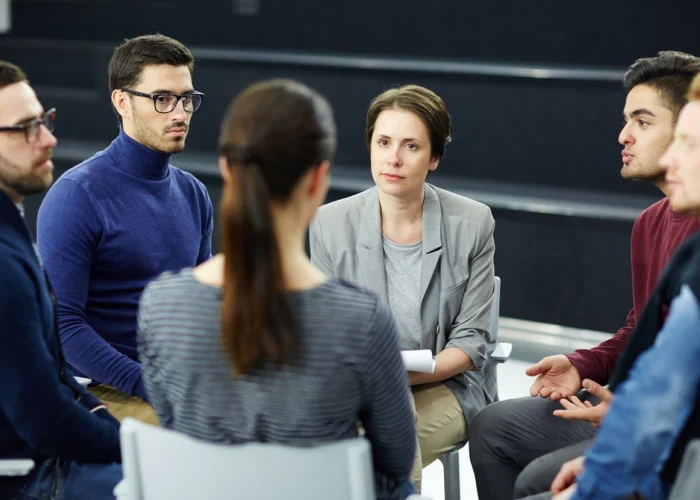 stock-photo-group-of-students-sharing-their-problems-during-psychological-session-682645633_(1)-transformed